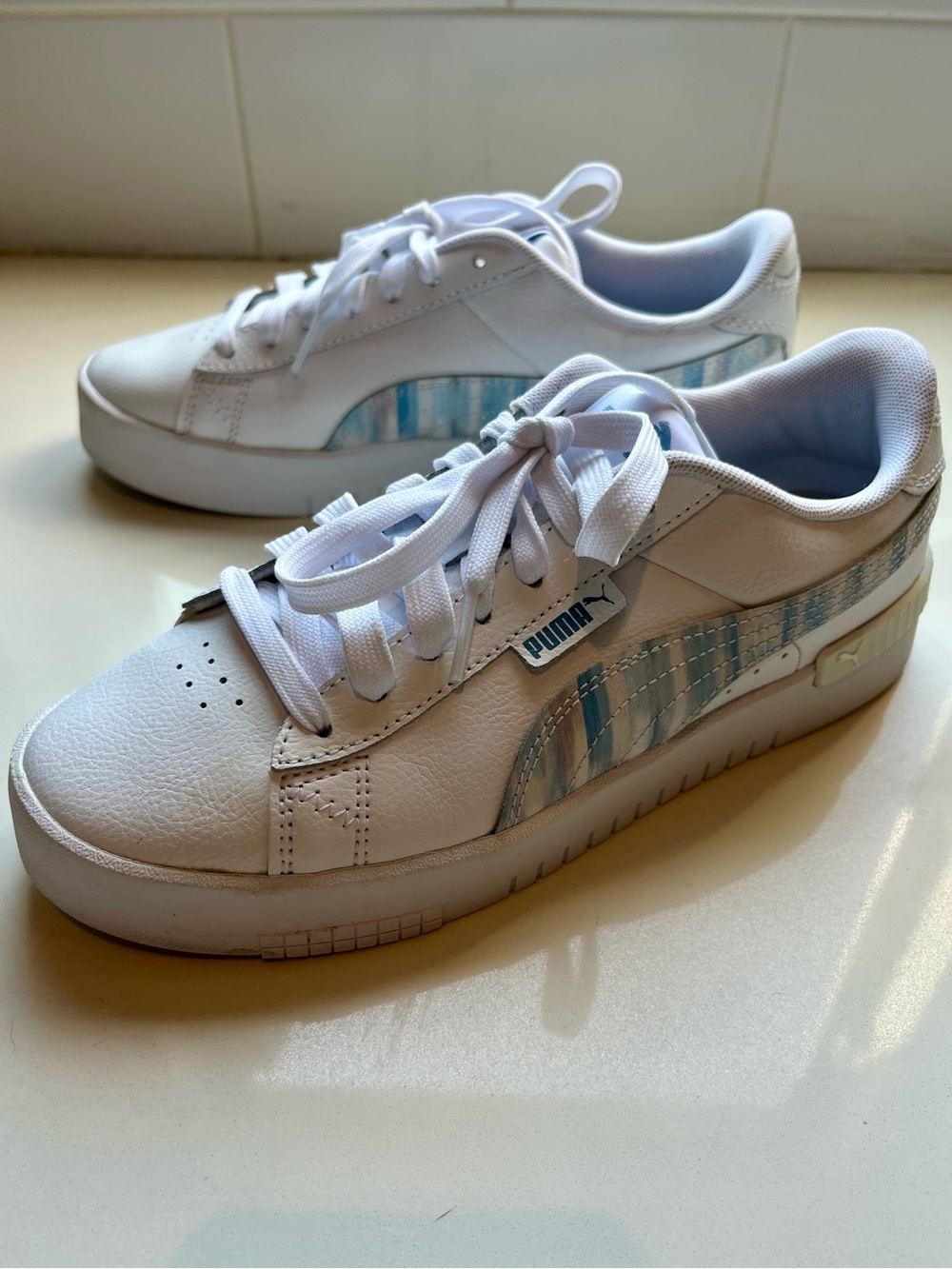 Puma White Sneakers with Light Blue Stripe Accent - women’s size 7
